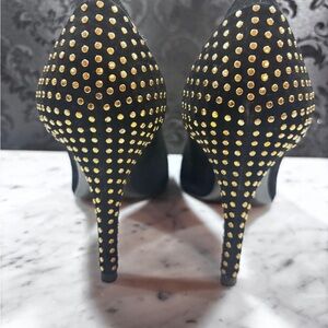 Stuart Weitzman black suede pumps with gold heel stud detail